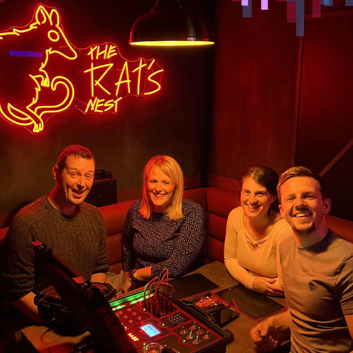 Friends having their photo taken after playing at Puzzled Escape Rooms Cardiff