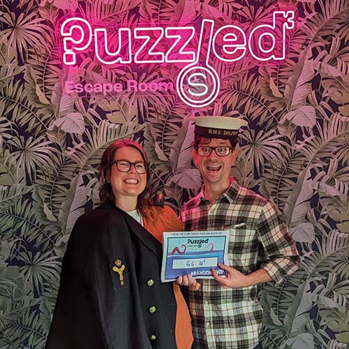 Fiends having their photo taken after playing at Puzzled Escape Rooms